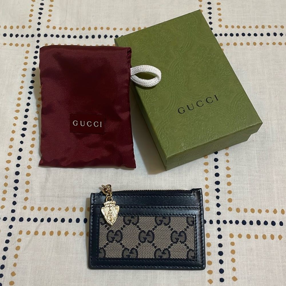 Gucci navy canvas and leather zip card holder with gold crest detail